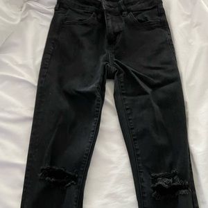 full length, black skinny jeans. ripped a bit at the knees